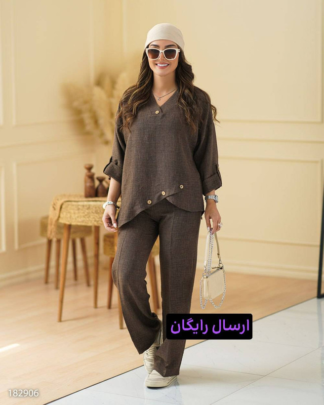 ست شومیز و شلوار زنانه مدل آدنیس کد 1829 با جنس شانتون، شامل شومیز یقه هفت و شلوار راحتی کمر کشی، مناسب سایزبندی 36 تا 48، طراحی شیک بهاره با دکمههای چوبی و جیب کاربردی